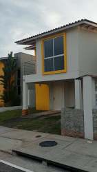 Exterior front view of two-story house with balcony in Residencial Santillana Panama Oeste