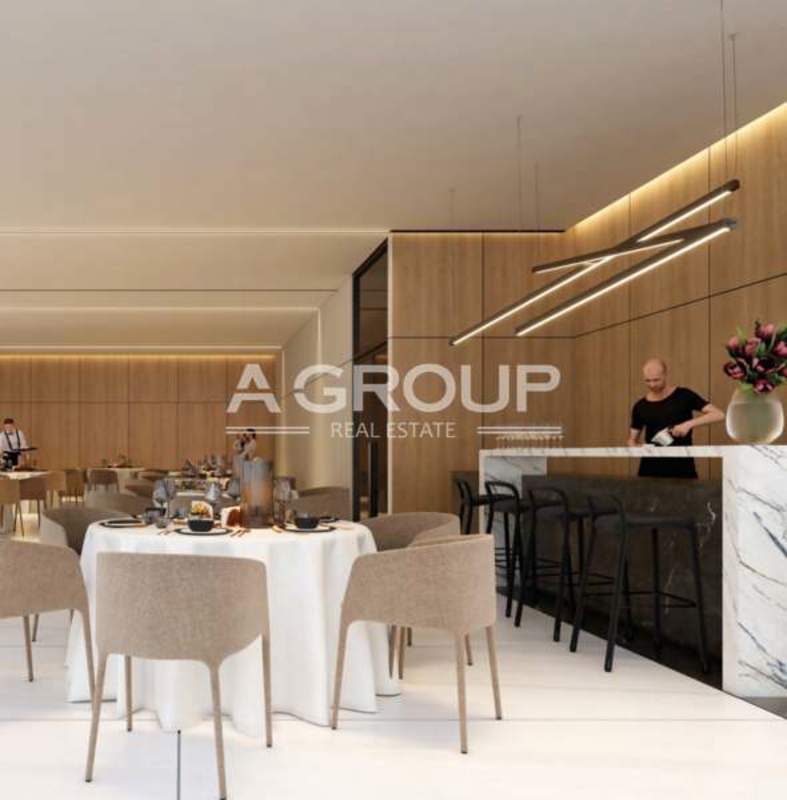Contemporary dining space with marble bar and stylish lighting at AquaPoint in Punta Paitilla