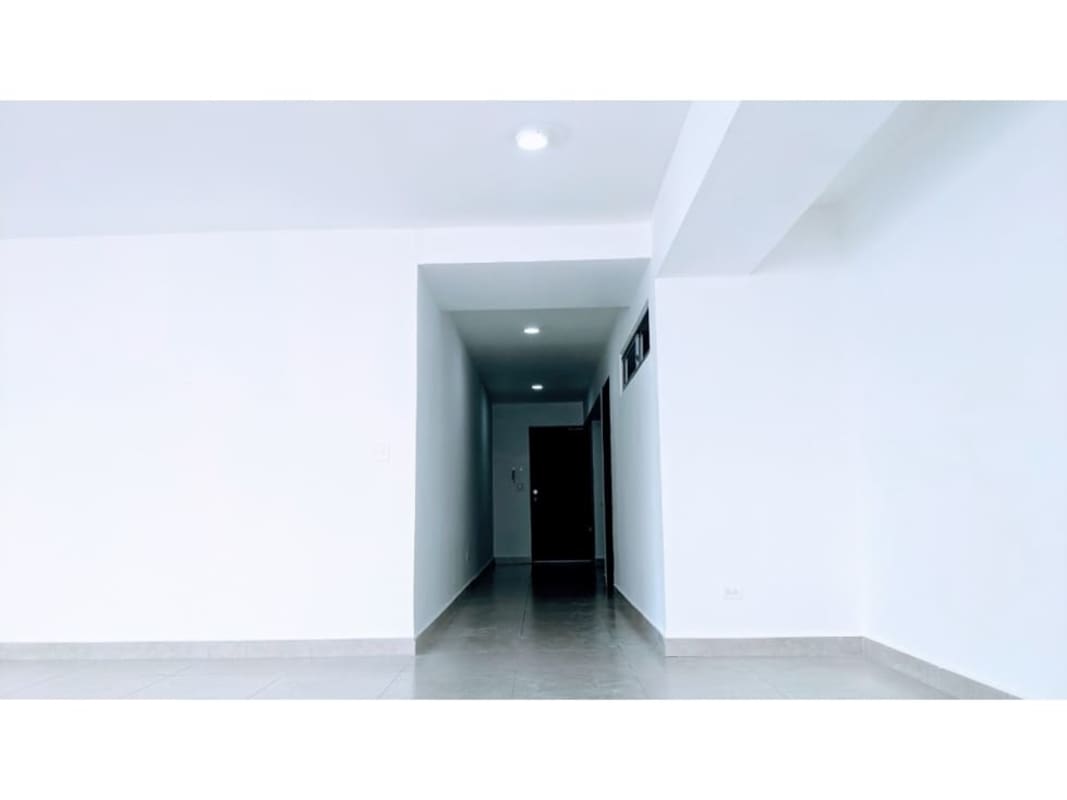 Large bedroom with closet, AC unit, tile floors overlooking Panama City at PH Keops