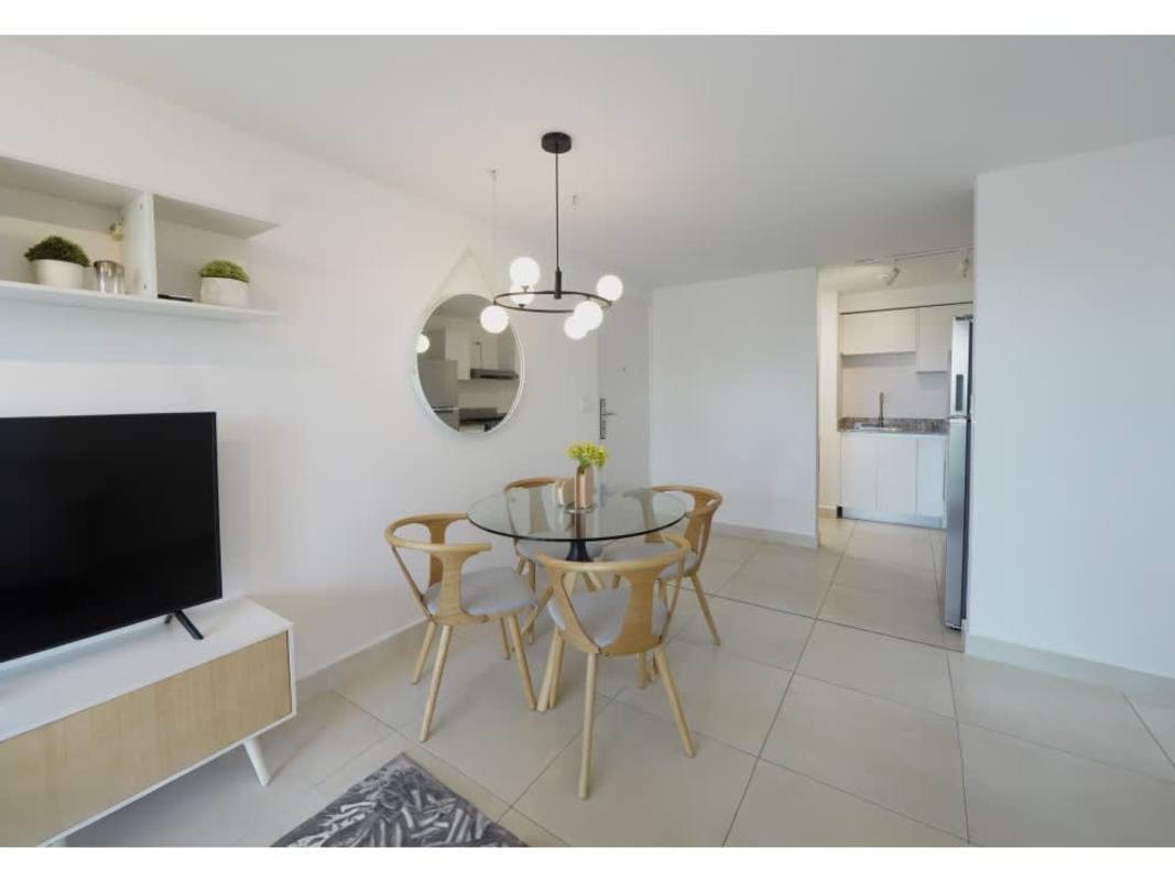 Contemporary open kitchen with granite countertops and stainless appliances Panama Viejo Residences Costa del Este