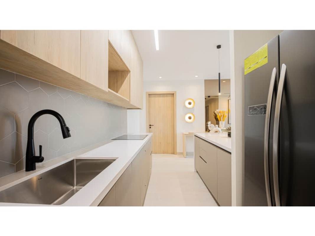 Hallway with built-in wardrobe, wood accent desk space, leading to bedroom in PH Nogal Costa del Este