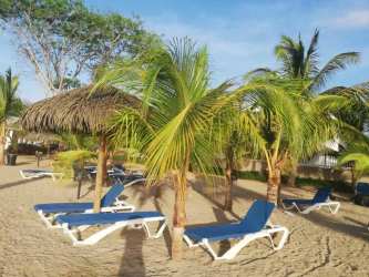 Main security gate with access control at Playa Dorada residential beach community Panama
