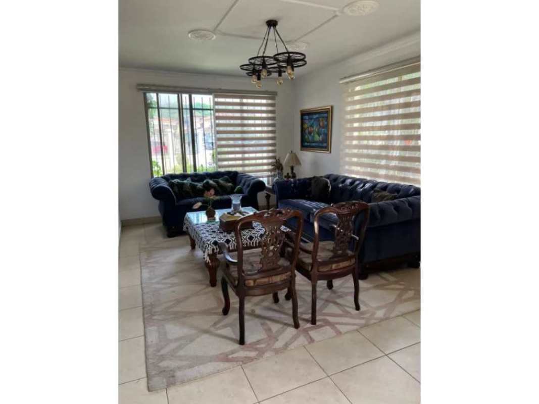 Spacious master bath with beige tiles, sink, and decorative accents in Paseo Dorado house Panama City
