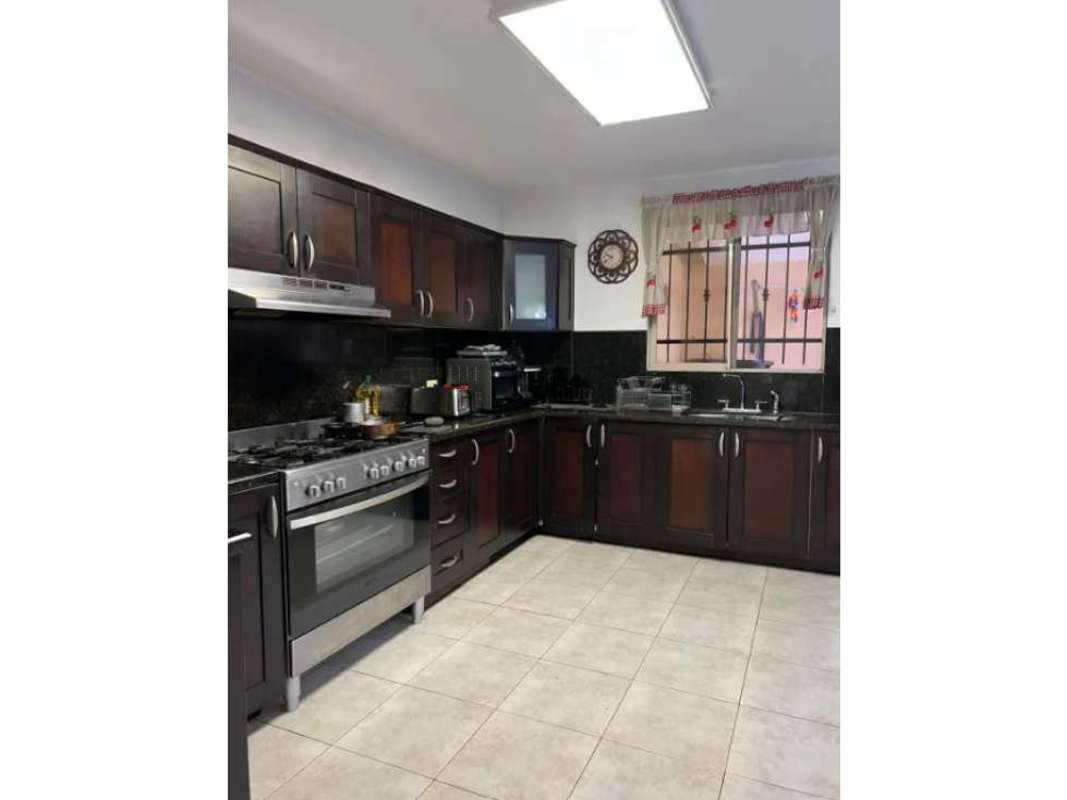 Entertainment area with bar, wood accents, TV, in home at Paseo Dorado Condado del Rey Panama