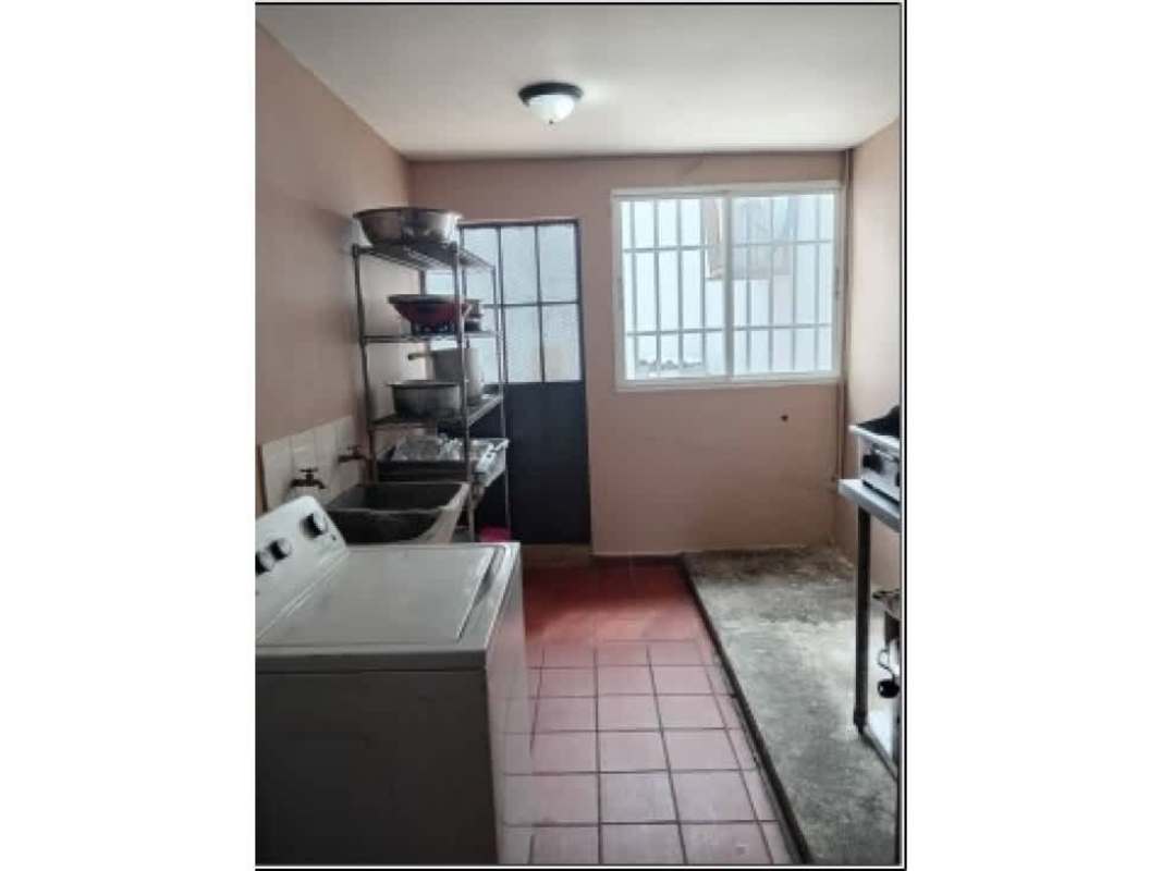 Covered garage with secure gates and tiled floor in Brisas del Golf Panama City