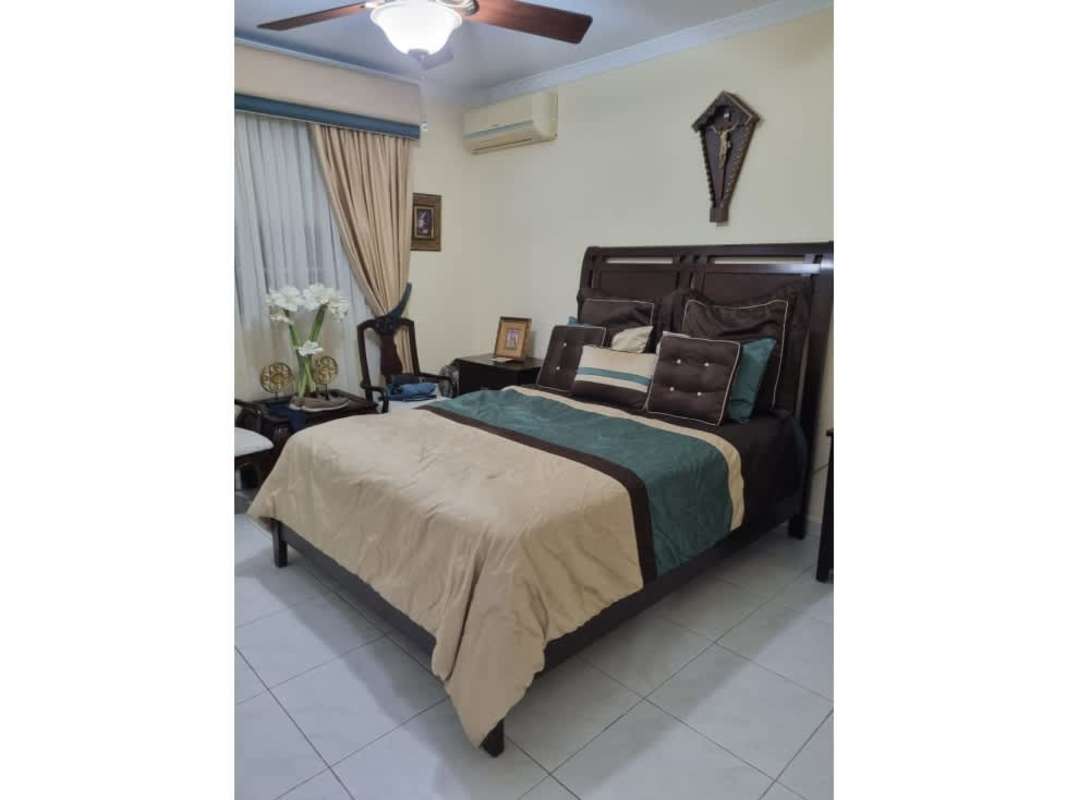 Spacious bright kitchen with white cabinets, double sink, modern appliances in Residencial Doral El Bosque Panama City