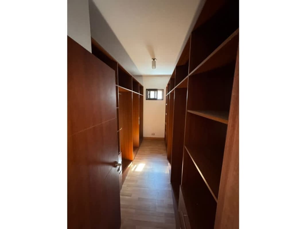 Modern kitchen with quartz countertops, wooden cabinets, spacious layout PH El Doral Costa Sur Panama