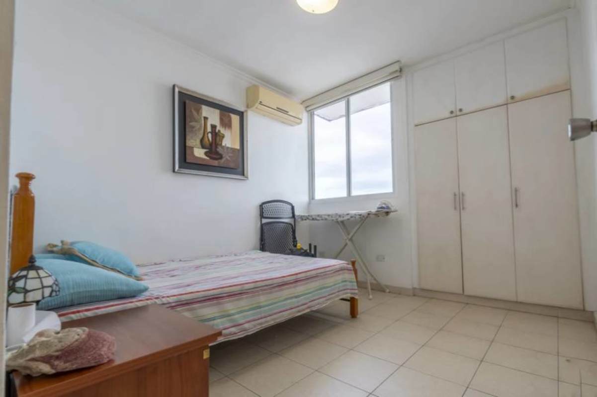 Outdoor swimming pool and sun deck with city views at PH Mandalay Vía Argentina