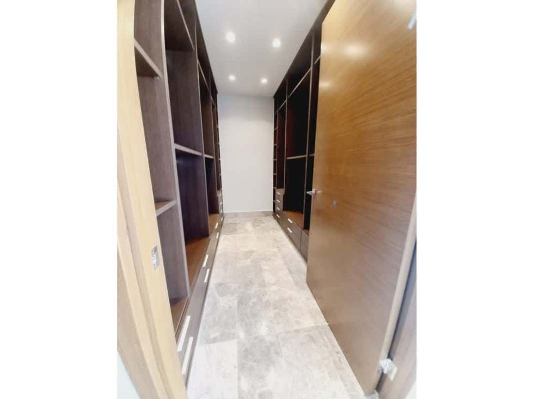 Bedroom with large windows overlooking golf course in Empire Residences Santa Maria Panama