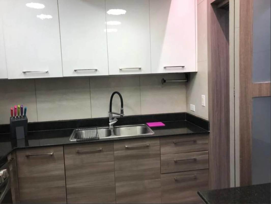 Contemporary kitchen with white and wood cabinets, granite counter PH Dos Mares Panama