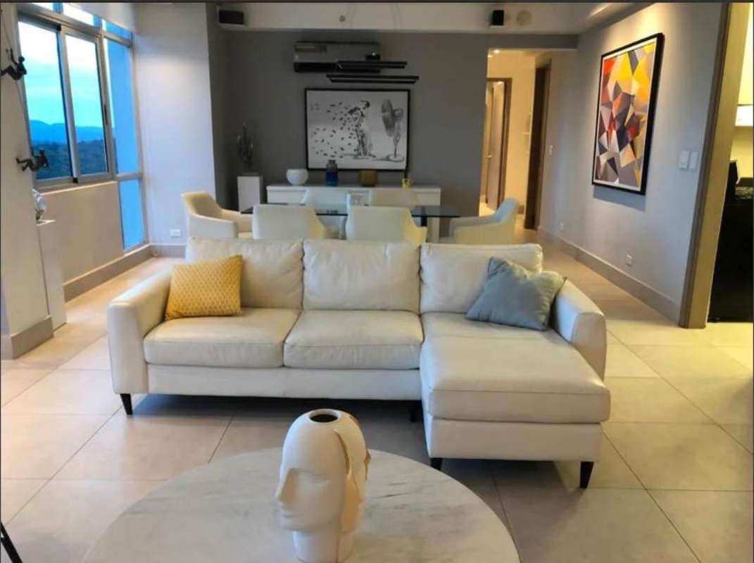 Bright living room with panoramic city mountain views in PH Dos Mares Betania Panama City