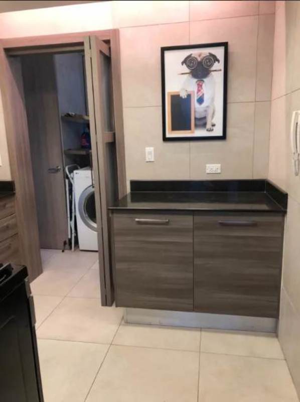 Bedroom brick accent wall upholstered bed built-in wardrobe PH Dos Mares Panama