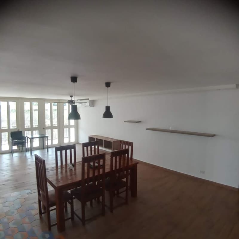 Open living dining area with wood floors large windows PH Sandra La Cresta Panama