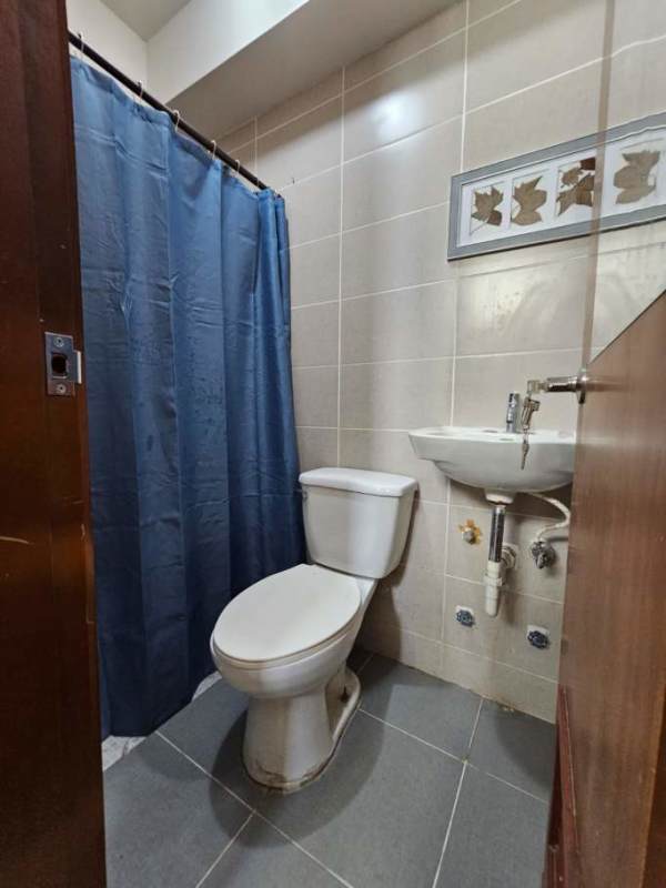 Bathroom with granite vanity and glass shower enclosure at PH Residencias del Sol Panama