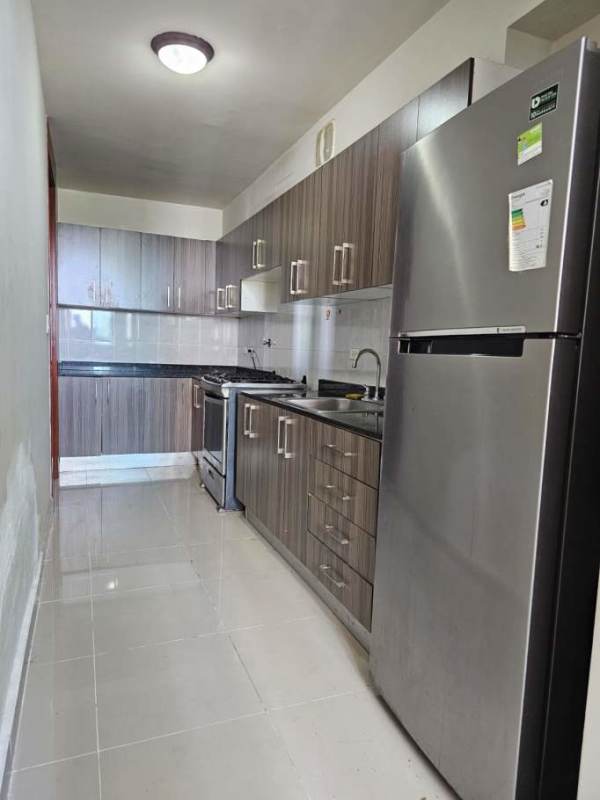 Outdoor pool area with lounge chairs city backdrop PH Residencias del Sol Panama