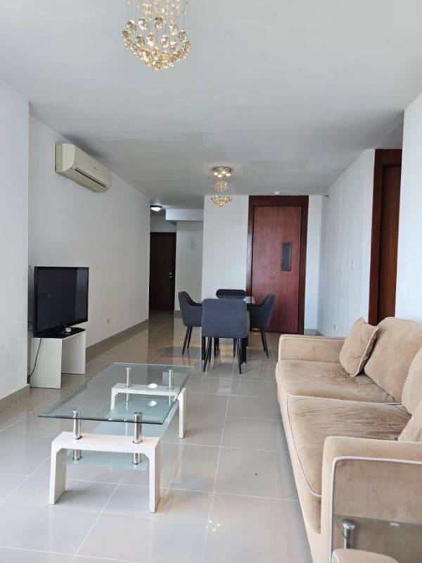 Galley kitchen with granite counters, refrigerator, stove at PH Residencias del Sol Panama