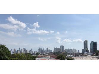 City skyline with modern high-rise buildings and greenery in foreground from El Dorado Panama