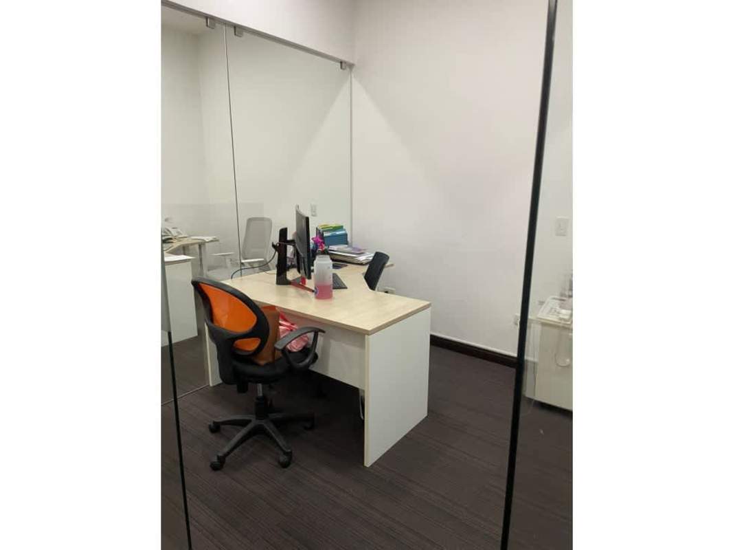 Modern conference room with glass walls and media panel in Santa María Office Plex Panama