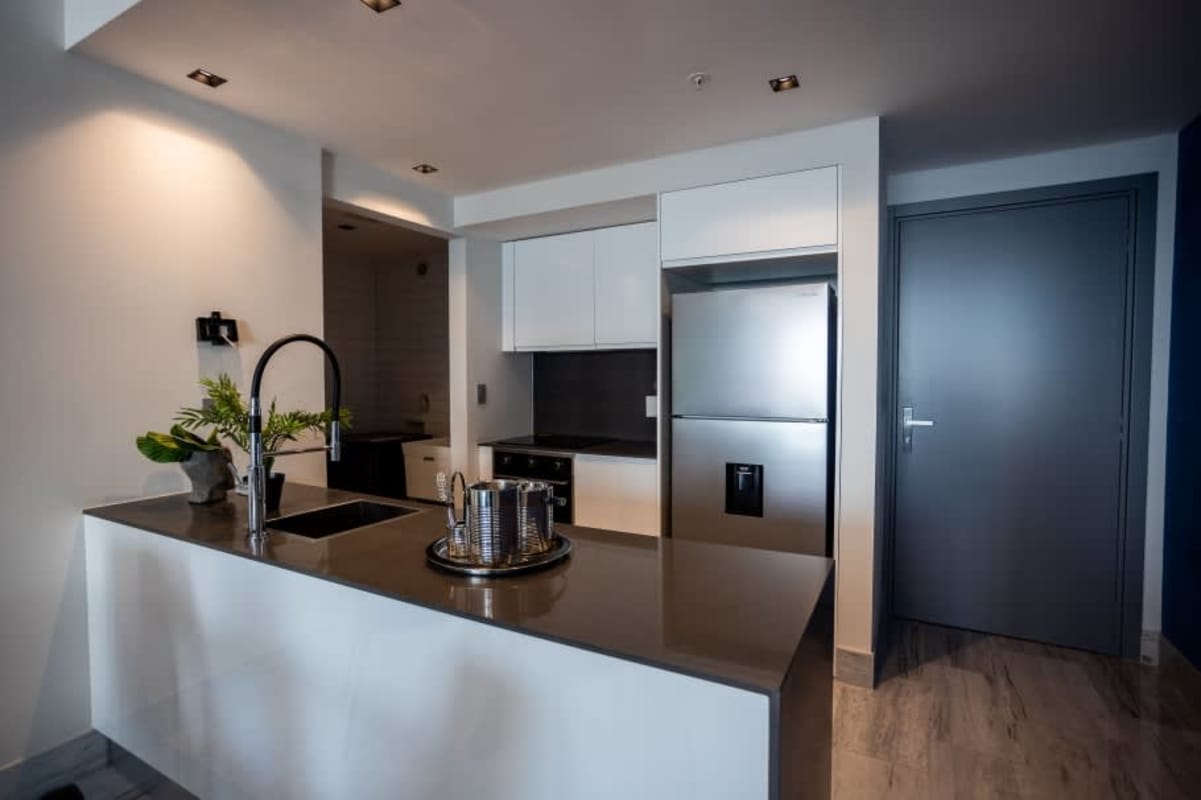 Bedroom with floor-to-ceiling window and city skyline views in PH BICSA Panama City