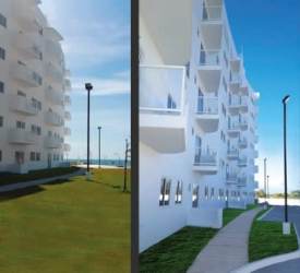 Exterior view of seaside condos at PH Playa La Barqueta with balconies and green landscaping in Chiriquí Panama