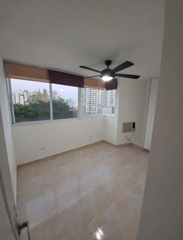 Bedroom with large window, wardrobe, ceiling fan and AC PH Elmare Plaza Edison Panama
