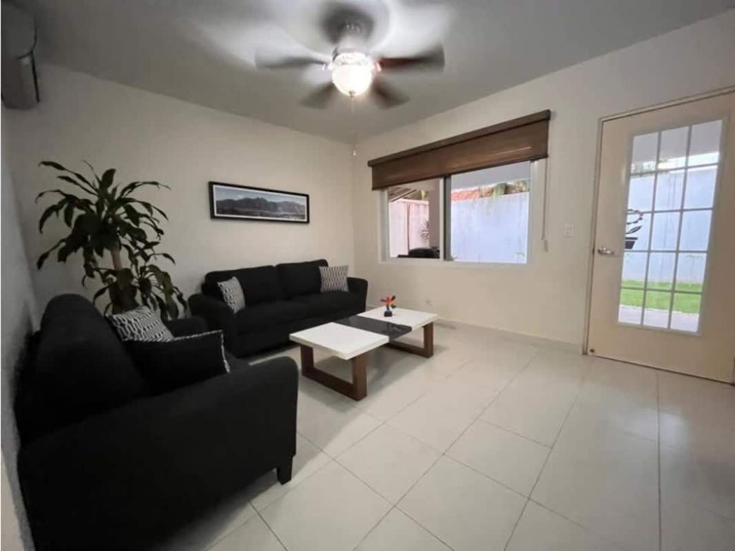 Bright living room with white tile floors ceiling fan window PH Quintas de Versalles Costa Sur Panama