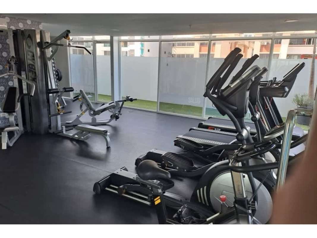 Modern gym with cardio machines and weights in PH Tee One San Francisco