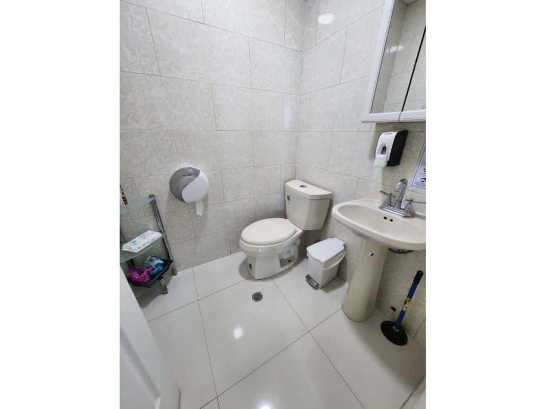 Modern tiled bathroom with pedestal sink in Oceania Business Plaza commercial office Panama