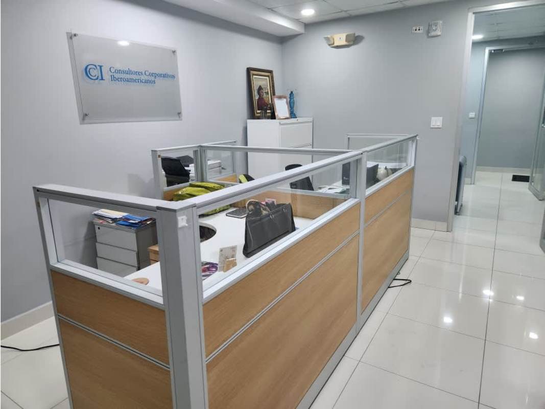 Reception area with blue accent wall and modern furniture at Oceania Business Plaza Punta Pacifica Panama