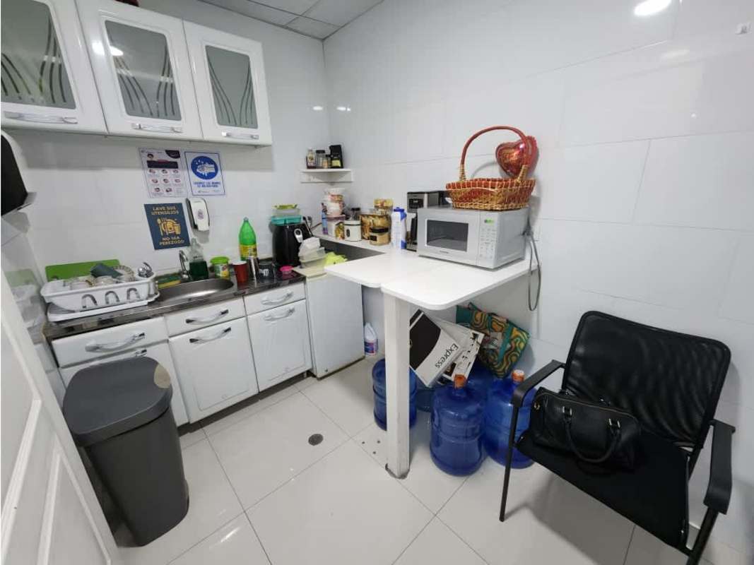 Compact kitchenette with cabinets and sink at Oceania Business Plaza Panama City