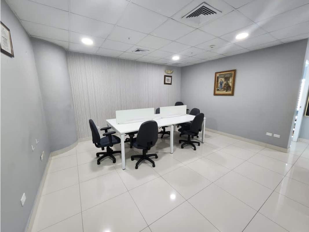 shared workspace area with tiled floors and cubicles in Oceania Business Plaza Panama City