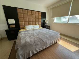 Master bedroom with large windows ocean views Nikki Residences Playa Blanca Panama condo for sale