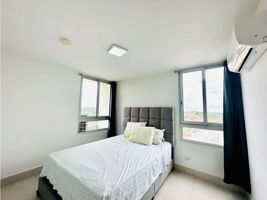 Modern bedroom with city view window and built-in closet in Greenwood Towers El Bosque Panama City