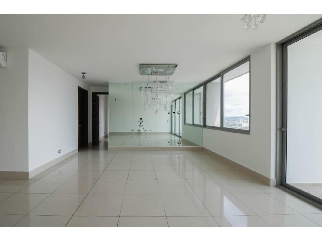 Bedroom with built-in closets and large window in PH Bali Costa del Este Panama