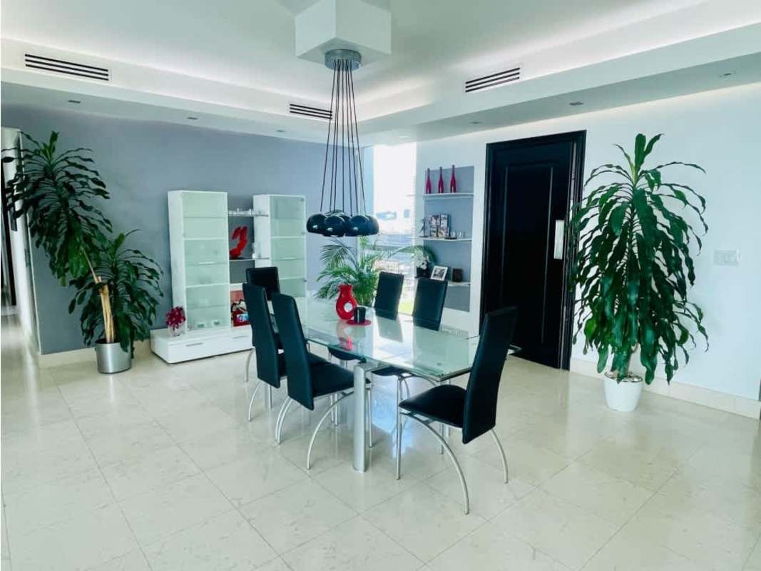 Contemporary dining room with panoramic windows ocean view PH Ocean Two Costa del Este Panama