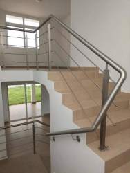 Bright open living room with tile floors and windows in Costa Verde house Panama