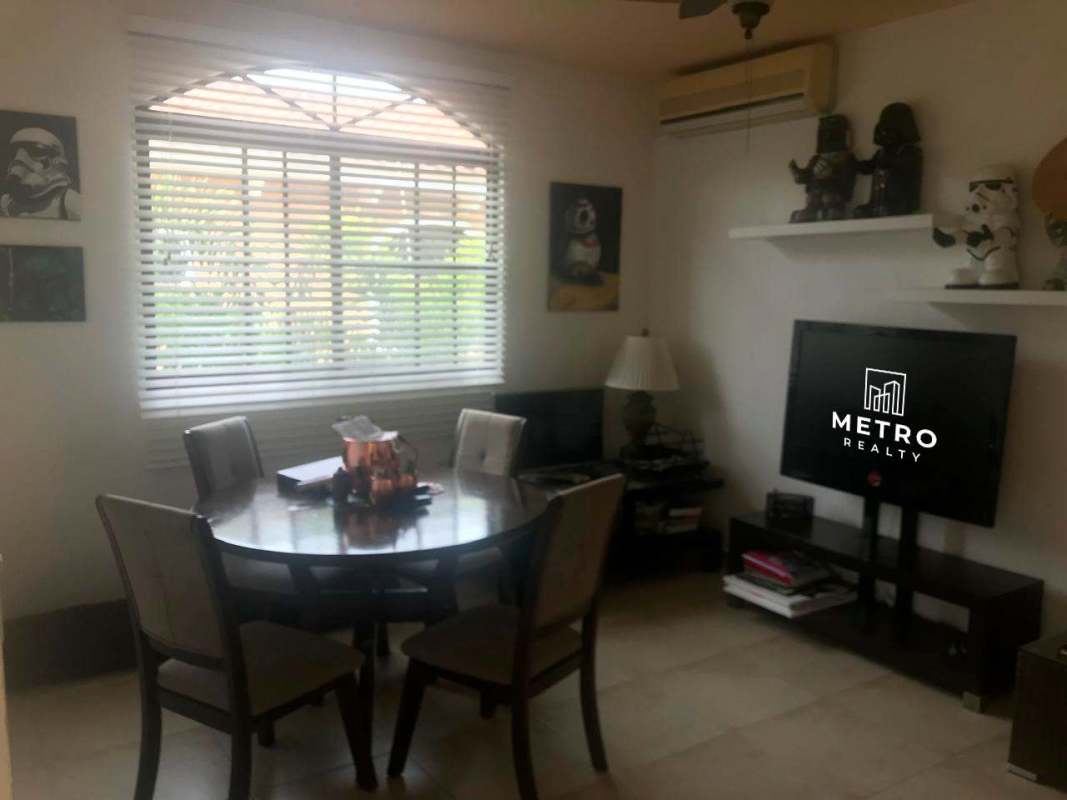 Private backyard with swimming pool, jacuzzi, covered terrace and tropical landscaping in Clayton Panama house