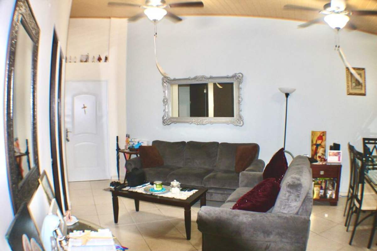 Dining table, sofa set, hammock in open living dining of Llano Bonito Gardens Panama