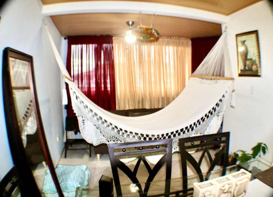 Children's playground set in grassy courtyard of Llano Bonito Gardens Panama City