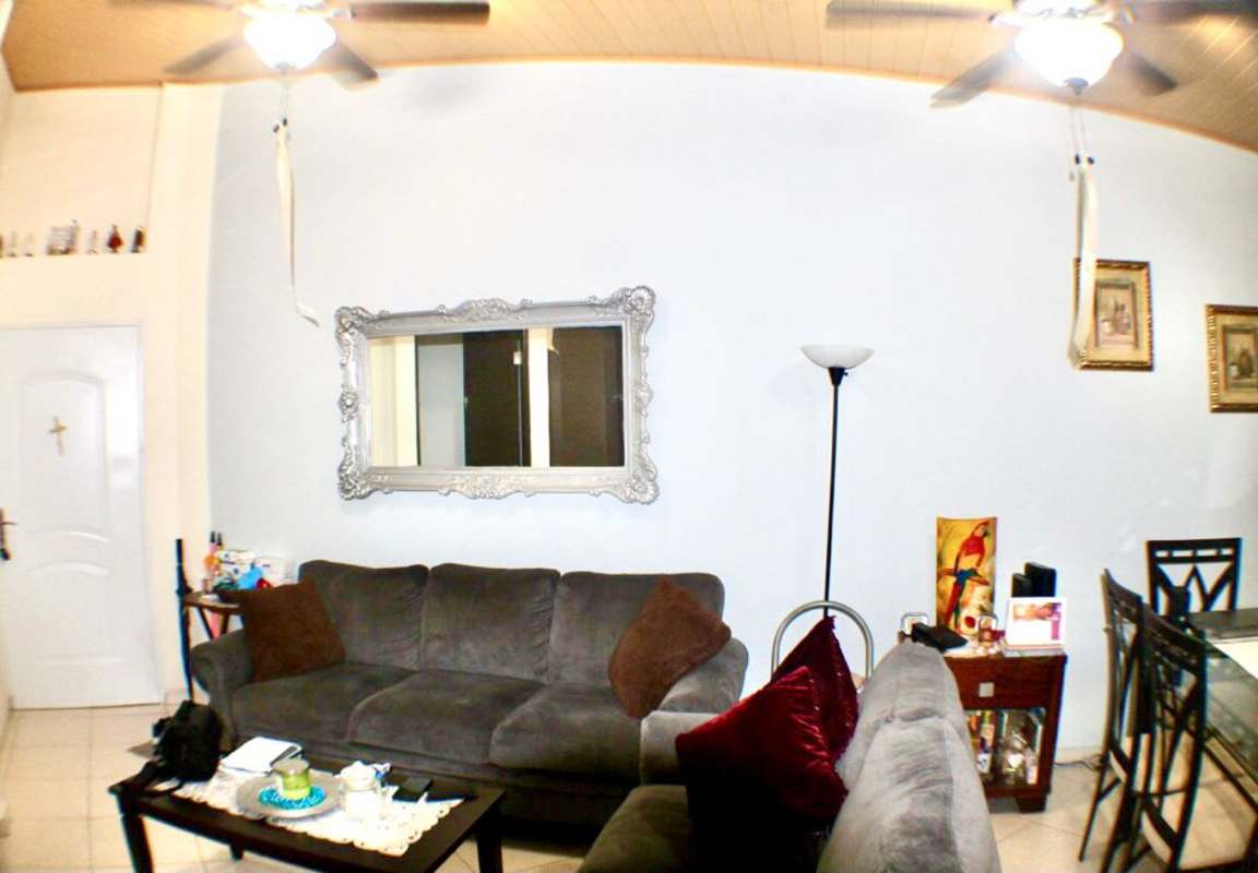 Furnished living space with sectional sofa, hammock and mirror in Llano Bonito