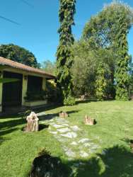 Stone path lush landscaped garden beach villa Coronado Panama