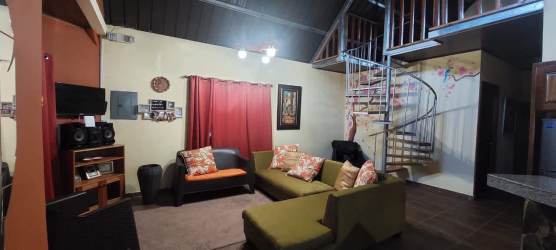 Dining area in rustic mountain cabin with garden views in Volcancito Boquete Panama