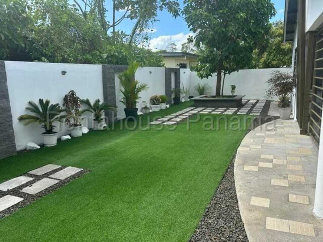 Terrace patio area overlooking private green garden for family gatherings in Chanis Panama