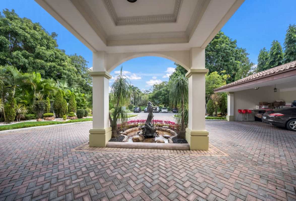 Mediterranean inspired enclosed patio with chandeliers and glass doors in Island Estates mansion Panama