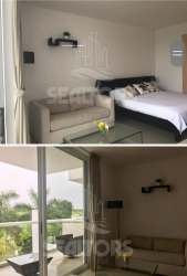 Living and dining with balcony ocean view Playa Blanca beach resort rental Panama