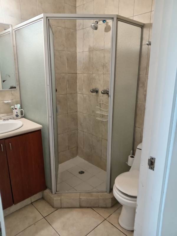 Contemporary bathroom with glass enclosed shower, vanity sink PH Riverside Condado del Rey Panama