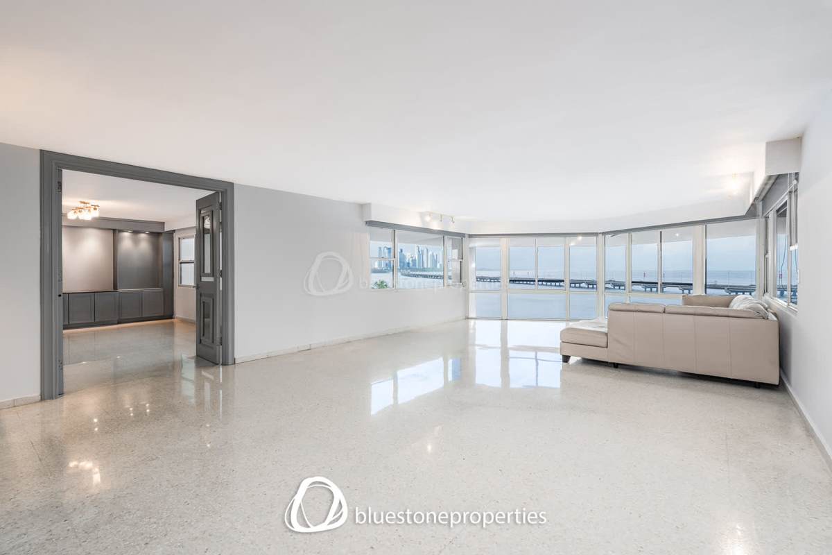 Bedroom with floor-to-ceiling windows, city skyline and ocean vistas Coco del Mar luxury residence