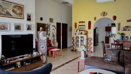 Living and dining open space with access to terrace in Punta Chame beach house