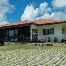 Barbecue grill outdoor dining covered terrace string lights relaxing tropical setting Panama vacation rental