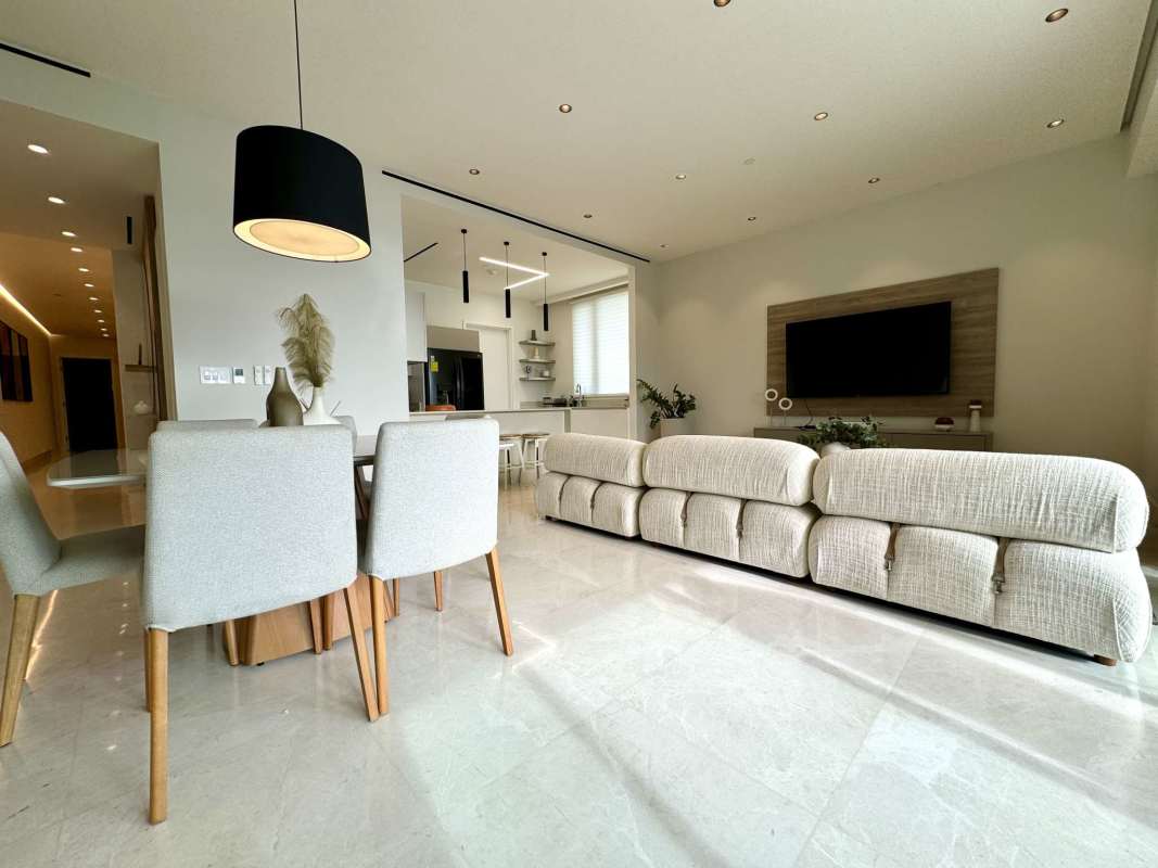 Luxury kitchen with marble island, gas stove, top appliances at Beach Club Residences Ocean Reef Panama